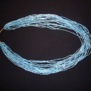 Iridescent blue beaded 24" slip over necklace